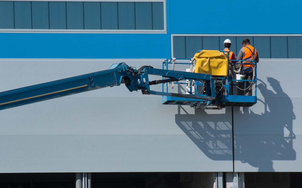 Side view of a boom lift with workers on it What Factors Affect a Forklift's Lifting Capacity? HTX Material Handling, Houston
