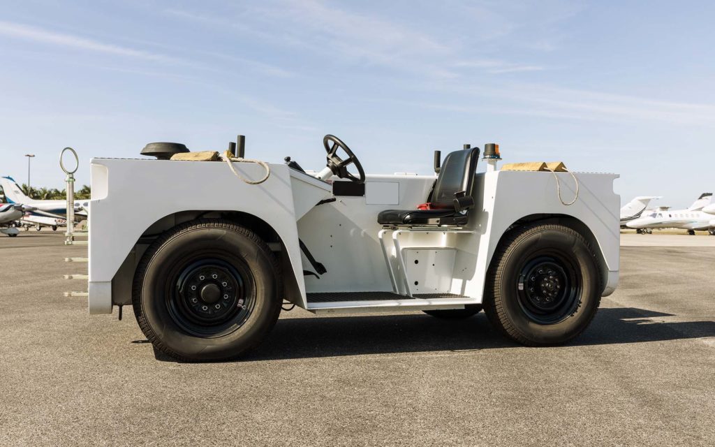 View of a terminal truck on the airport runway Purchase Price vs. TCO: How to Make an "Intelligent" Acquisition, HTX Material Handling, Houston