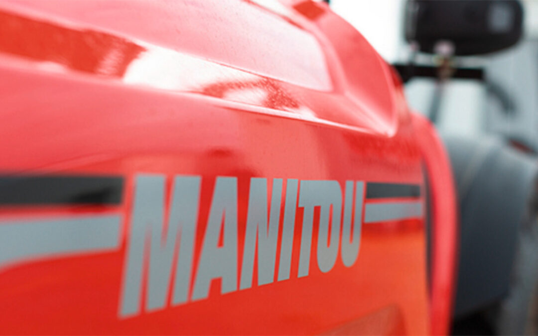 Close up side view of a piece of Manitou equipment