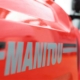 Close up side view of a piece of Manitou equipment