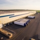 Trucks Loading Packages At Warehouse